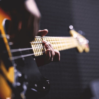 Entertainer Strums Electric Guitar