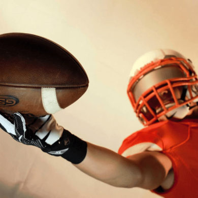 Footballer Player Catches Football Mid-Air